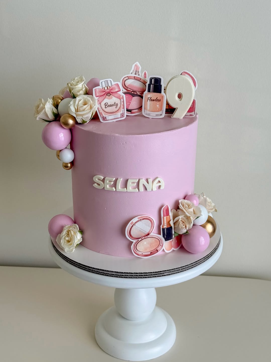 pink makeup and beauty themed 9th birthday cake